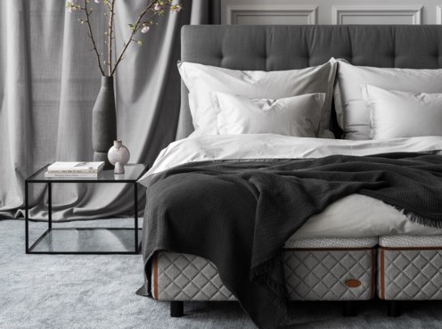 Bedroom environment - DUX bed 2002 with Dante headboard and Alberto table.